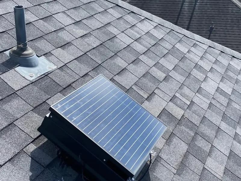 Solar attic fan on a residential roof